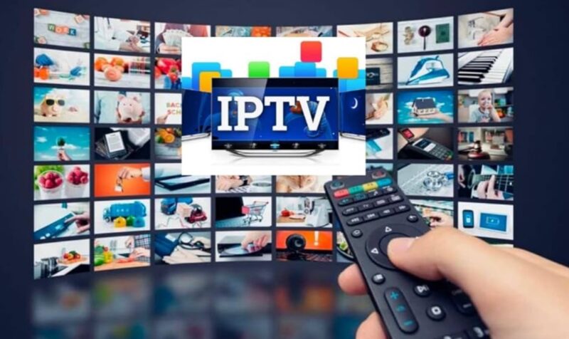 Hand holding a remote while watching IPTV