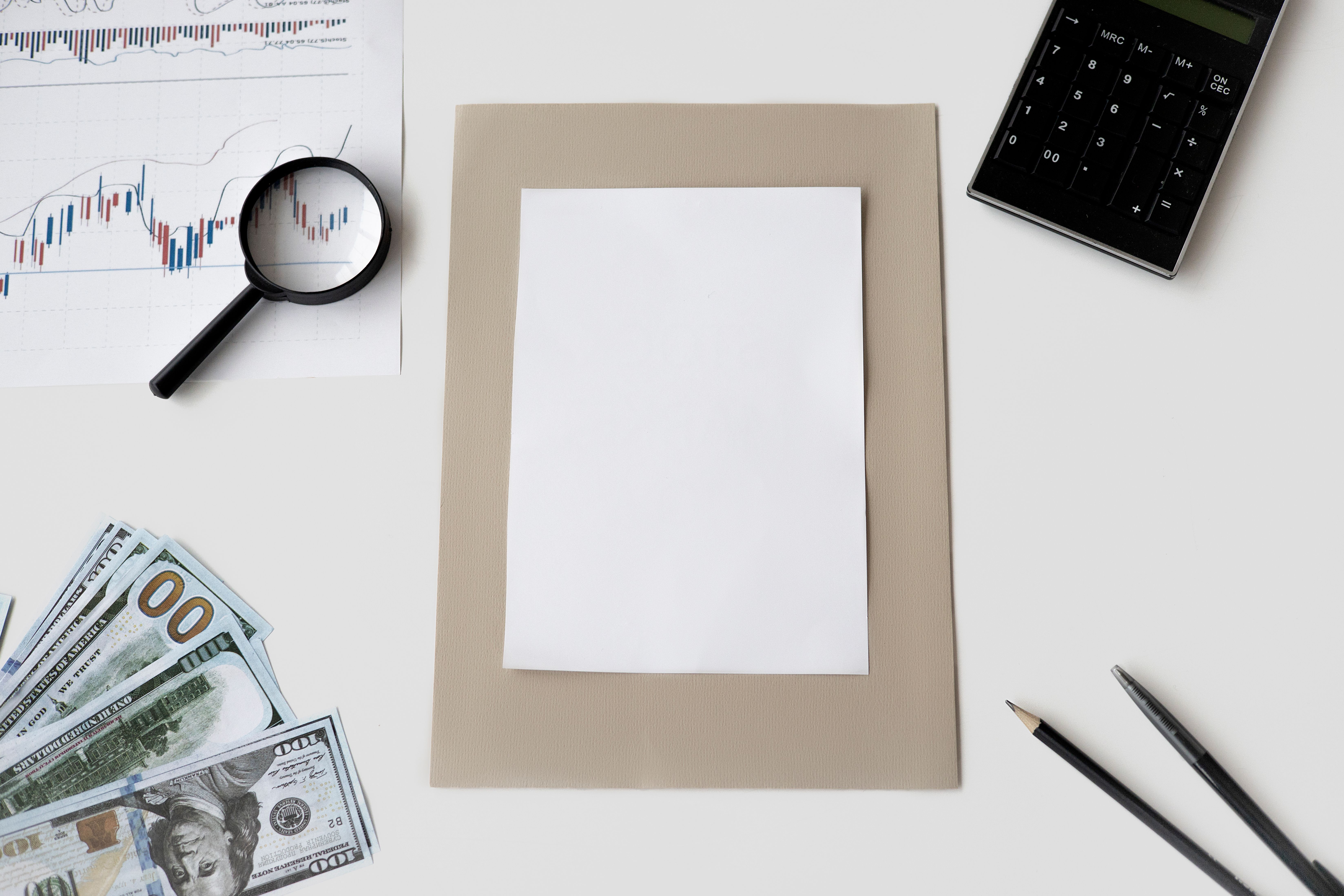 Flat lay of financial planning tools and paperwork representing litigation finance